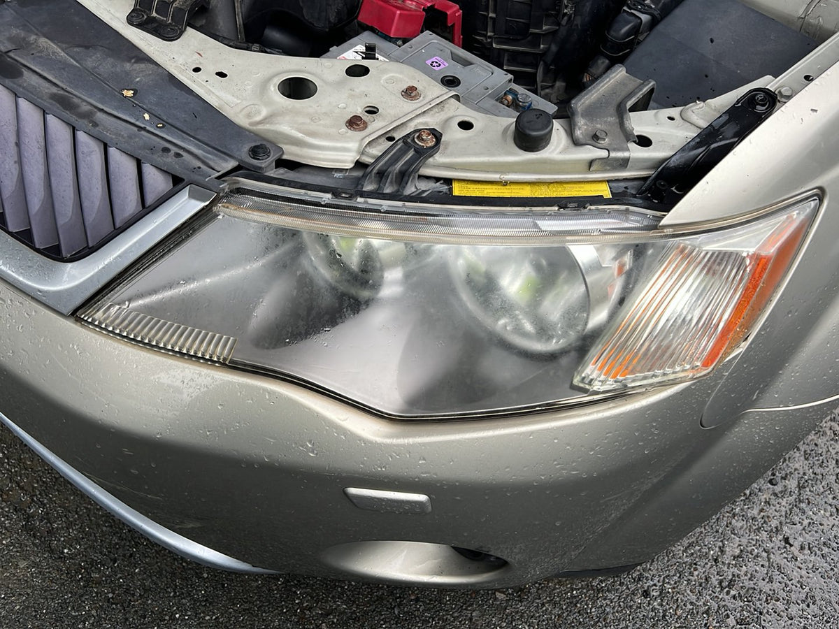 2007 Mitsubishi Outlander JMFXLCW6W7Z000139 - Left Headlight PN: 5585l