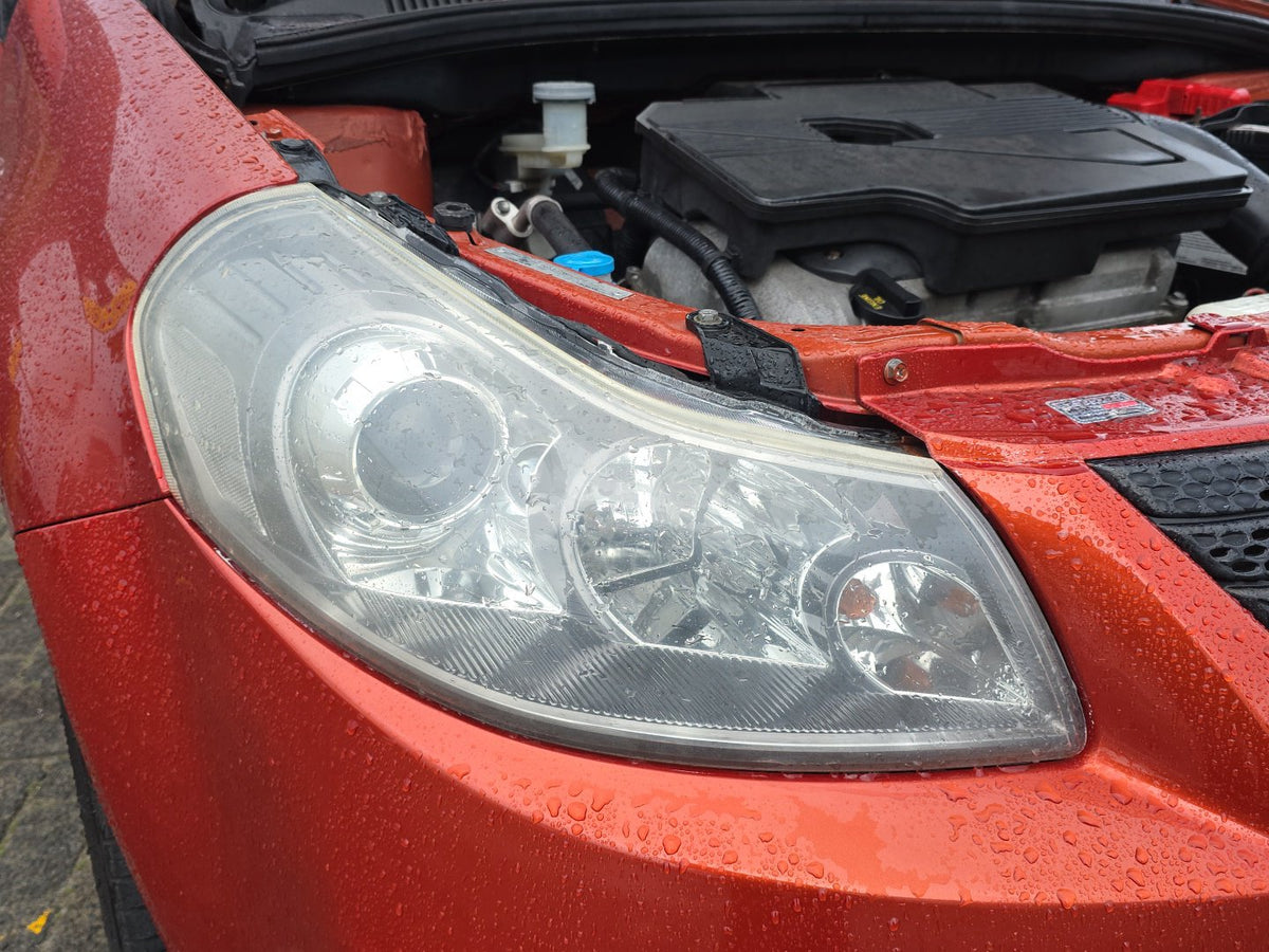 2006-2012 Suzuki SX4 YA11S - Right Headlight PN: Koito 100-59104